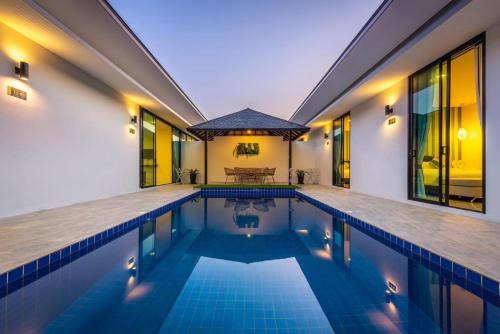 Si Sunthon Villa | Lespalm Resort by Vacayandco