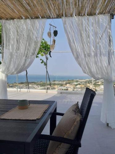 Minothiana House | The Serene Veranda with breathtaking views