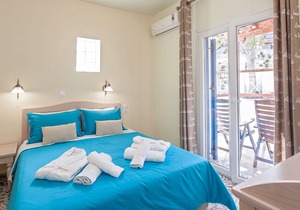 Suite with separate bedroom and mountain view