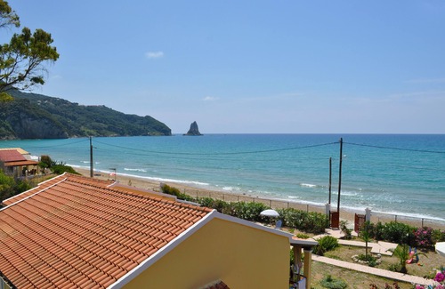 Agios Gordios House | Beachfront Vacation Home "eftichia"