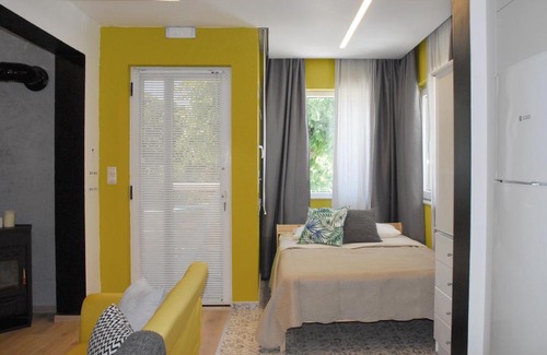 Heraklion Apartment | Modern house with garden and bathroom TV in front of the Venetial Walls