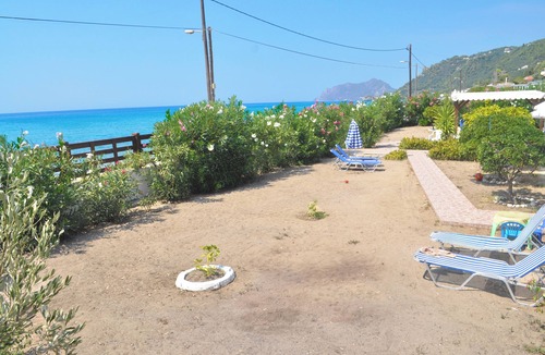 Agios Gordios House | Beachfront Vacation Home "eftichia"