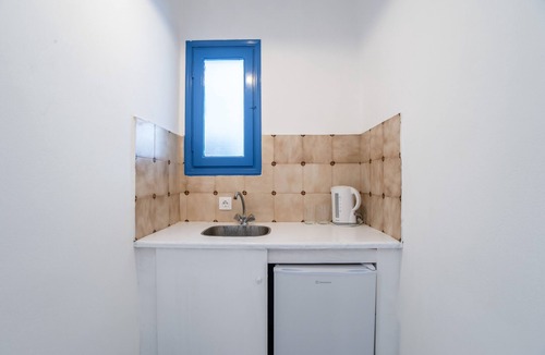Perissa Apartment | Economy Quadruple Room 1 with Balcony and Air Conditioning