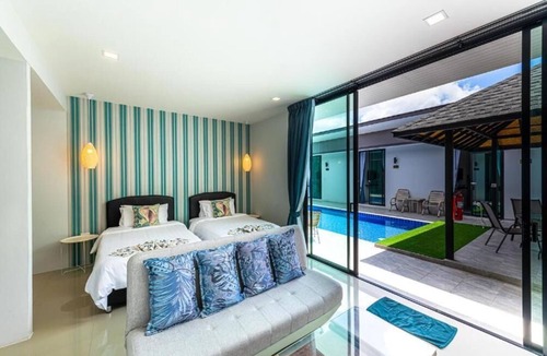 Si Sunthon Villa | Lespalm Resort by Vacayandco