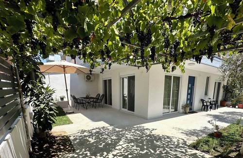 Olymbiaki Akti Apartment | Modern Seaside Home with Private Patio + Parking - Blue Zone Homes