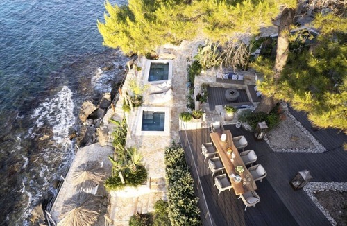 Amoudi Villa | Waterfront Villa Alexandros with Outdoor Jetted Tub
