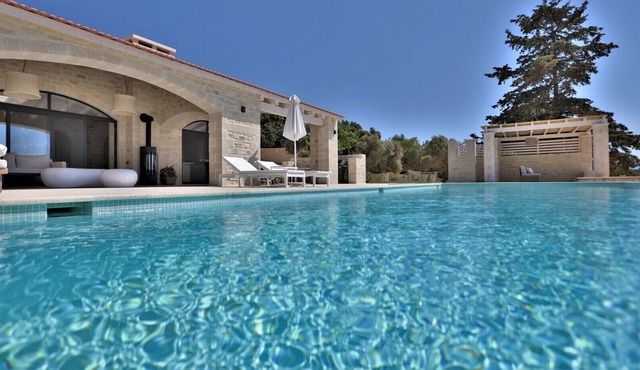 new natural stone villa with large pool and great sea views in Prines