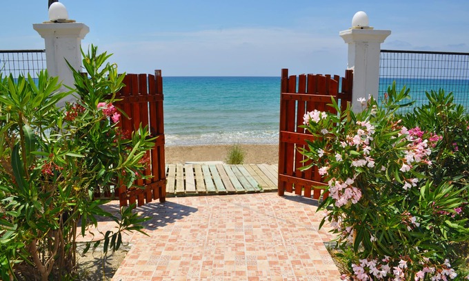 Agios Gordios House | Beachfront Vacation Home "eftichia"