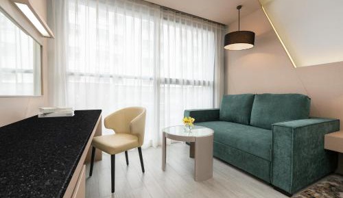 Deluxe Double Room with Two Single Beds and Sofa Bed