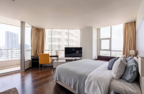 Sathorn Apartment | Midcentury 2BR apt w/WiFi, turntable, game console in CBD Bangkok