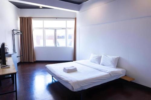 XXGO INN Thaphae Chiang Mai - กำแพงดิน